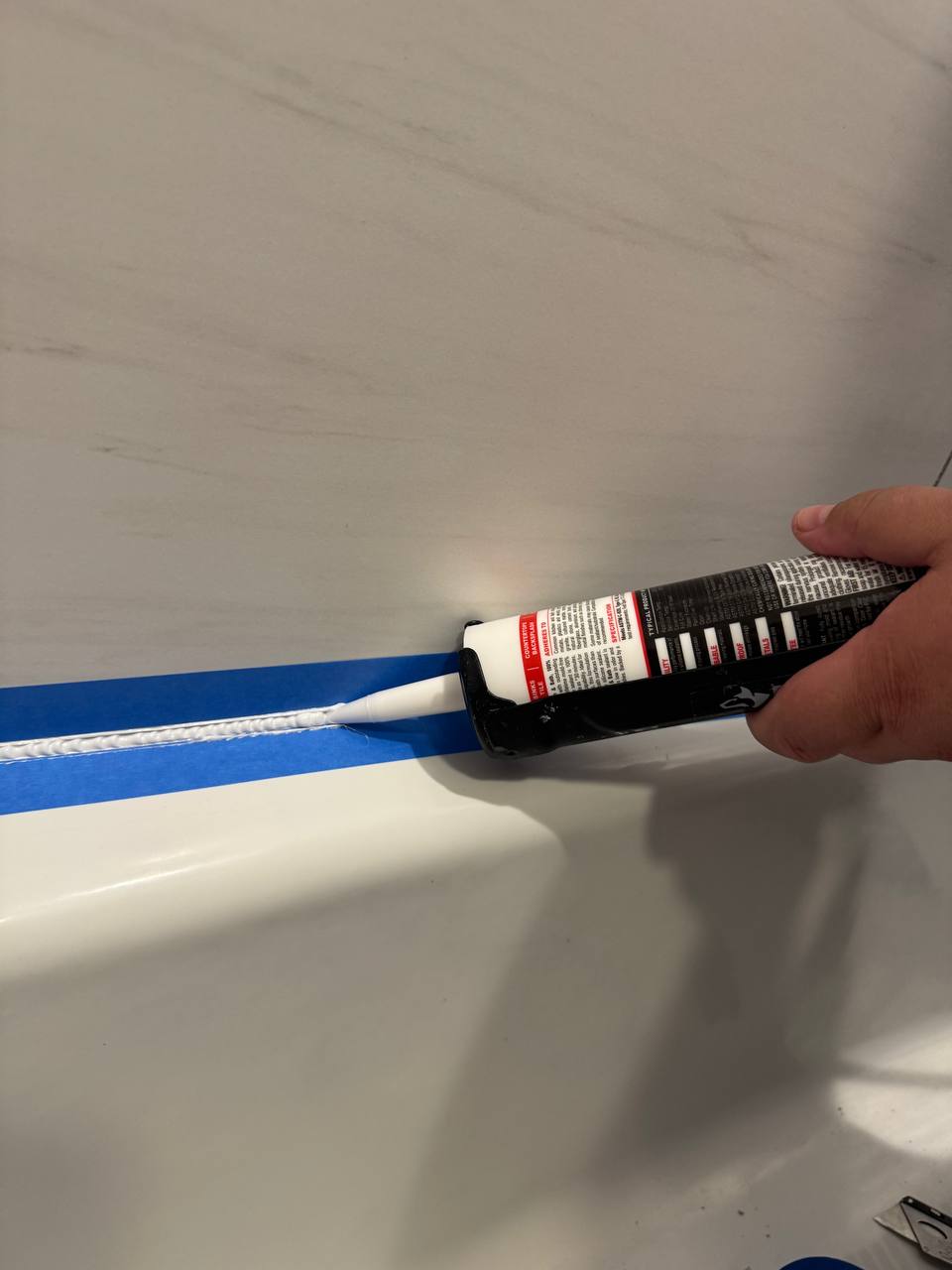 Fresh caulking around bathtub