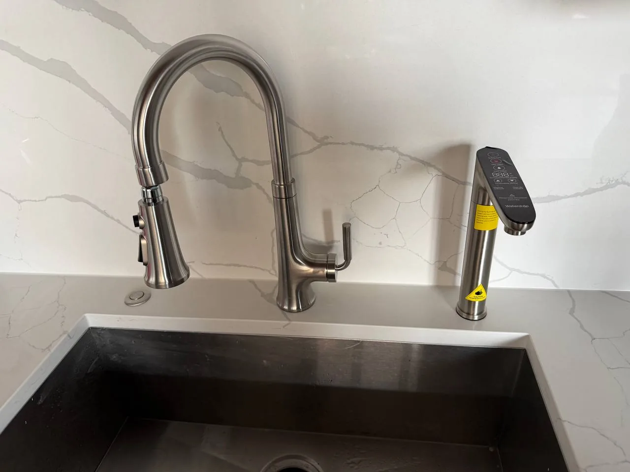 Kitchen faucet installation completed by VIV Home Solutions