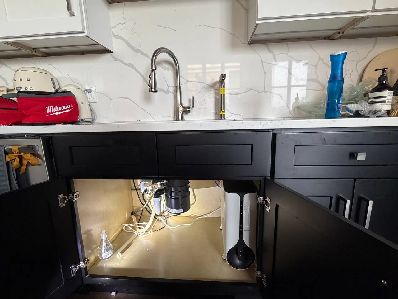 Under-sink plumbing project completed by VIV Home Solutions