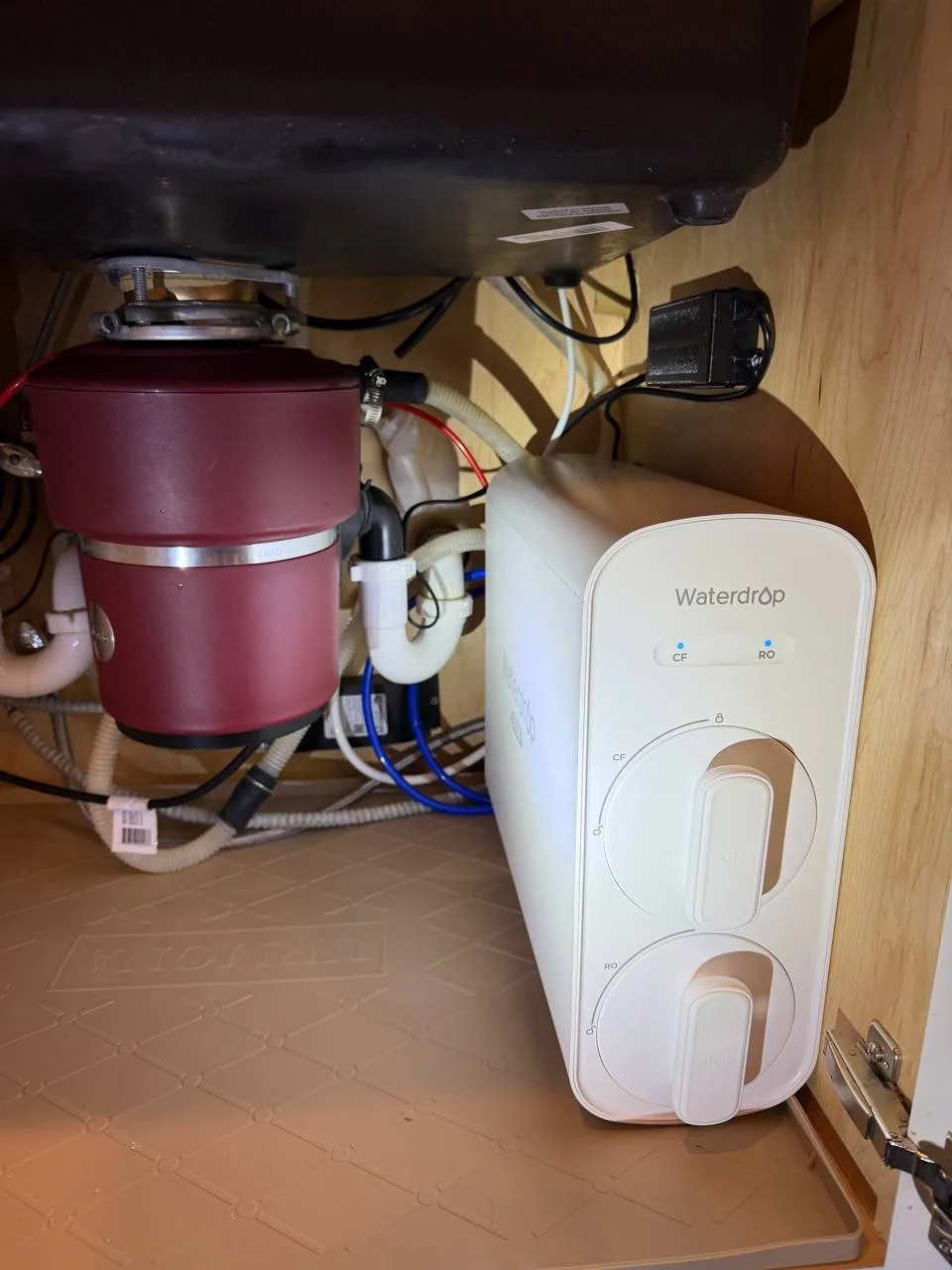 Garbage disposal and under-sink plumbing installation